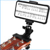 An adjustable guitar phone mount with a staff displaying musical notes and lyrics for hands-free viewing.