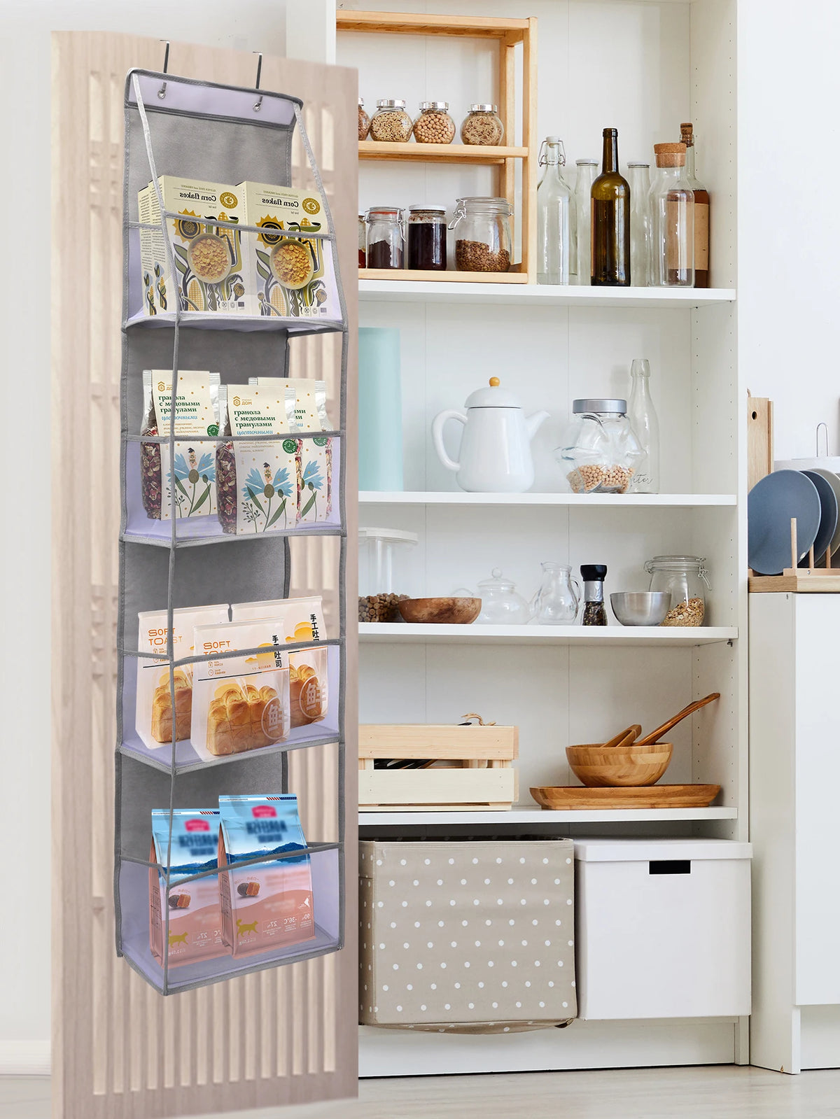 A wooden over-the-door hanging organizer with clear compartments holding various food items and small containers.