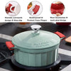 A light green heat-resistant silicone pan handle cover with a silver knob is shown on a stovetop.