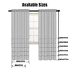 Two panels of light gray sheer voile curtains shown hanging in a window frame.