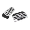 A set of black and silver universal car pedal covers for sports pedals.