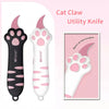 Pink and black utility knife shaped like a cat paw for grooming or other tasks