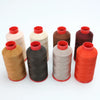 Five spools of heavy-duty nylon bonded thread in various colors including beige, black, gray, and orange.