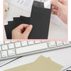 A hand is shown opening a black kraft paper self-adhesive envelope, with several envelopes laid out on a white surface.