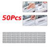 A set of 50 self-adhesive window screen repair patches for fixing cracks and holes in windows.