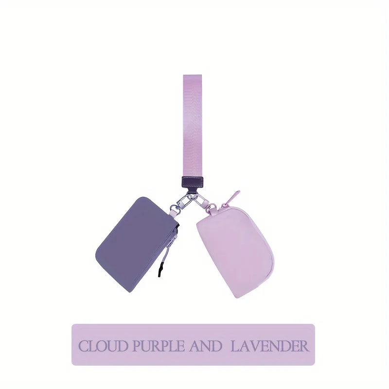 A lilac wristlet wallet with a pink strap and a detachable coin pouch.