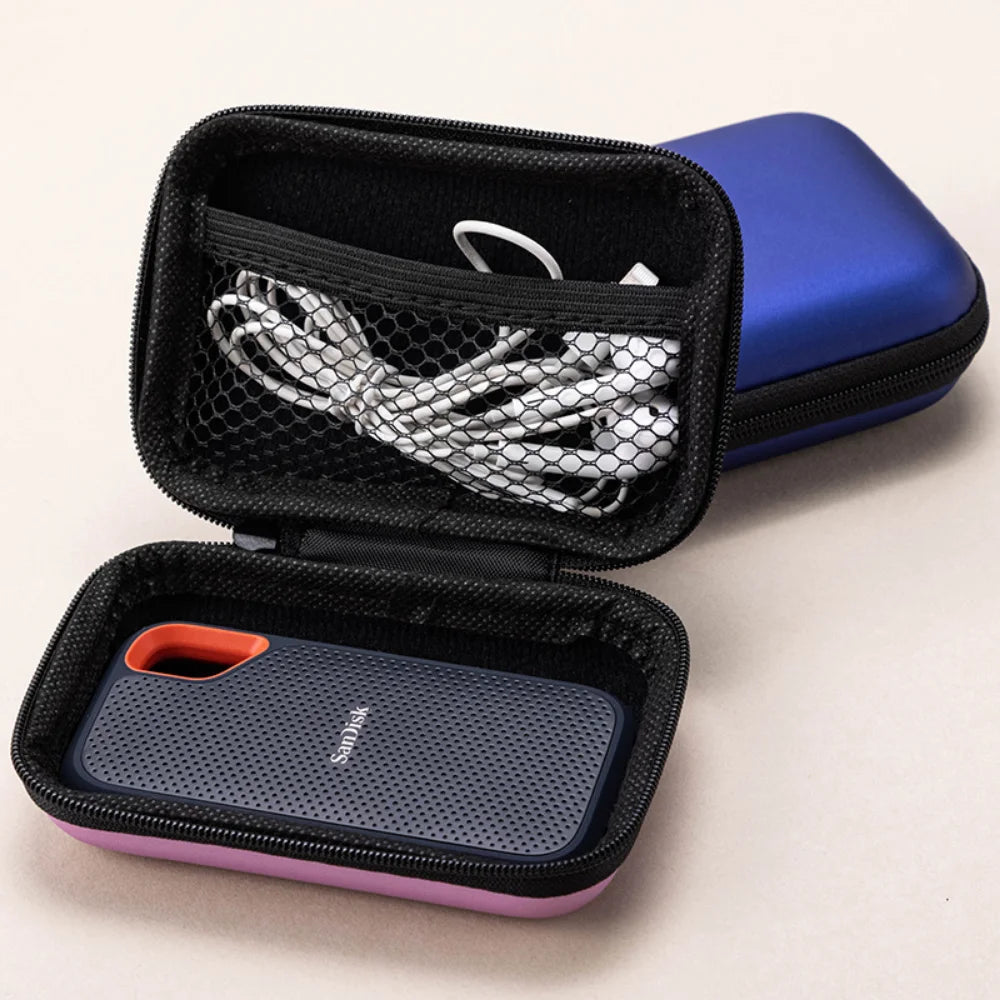 A black protective case for a SanDisk Extreme portable SSD, featuring a blue outer shell and a purple inner sleeve.