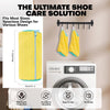 A yellow breathable shoe washing bag with a zipper hanging on a clothes rack next to a washing machine.
