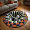 A round rug featuring a skull design with striped patterns in orange, green, purple, and black.