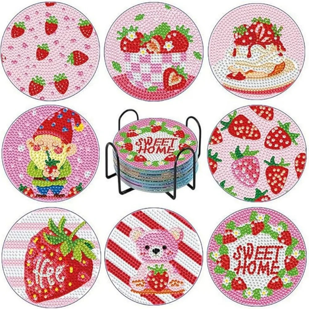A set of pink and red strawberry-themed diamond art coasters with metal stands.