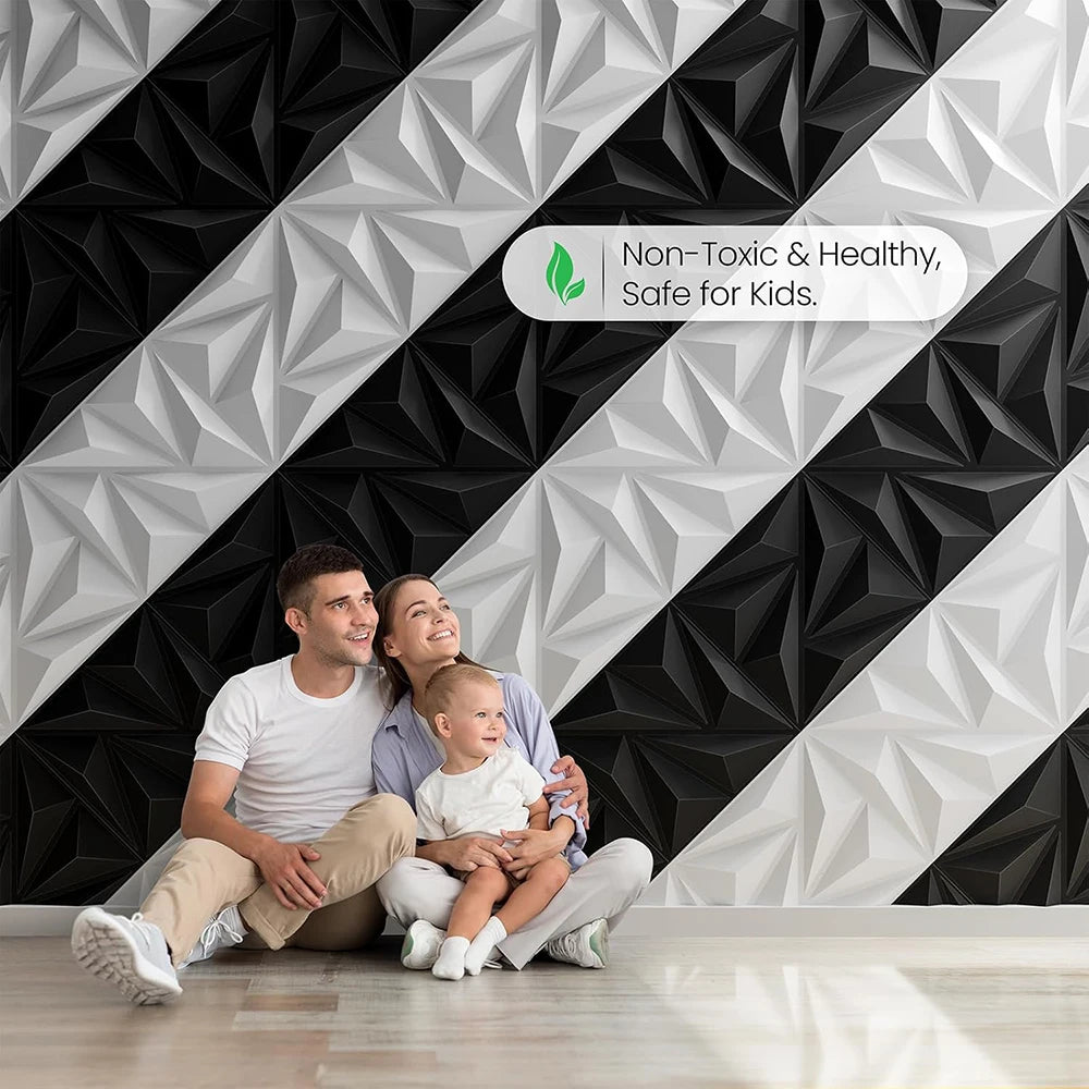 A family of three smiling while sitting on a floor in front of a modern diamond textured accent wall.