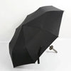 A black, anime-inspired folding parasol or umbrella with a pointed design.