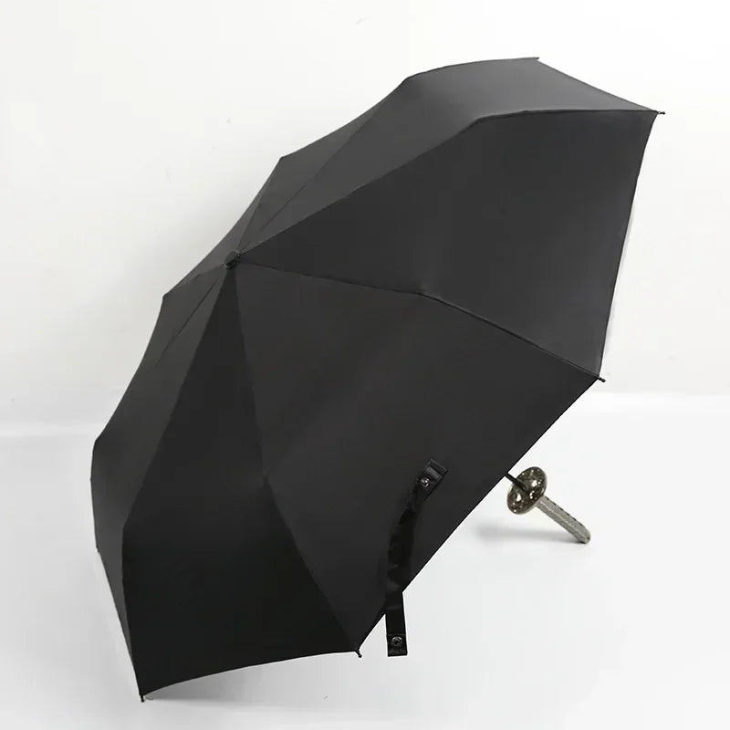 A black, anime-inspired folding parasol or umbrella with a pointed design.