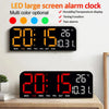 A black LED large screen alarm clock displaying the time 20:15 and temperature 26 degrees.