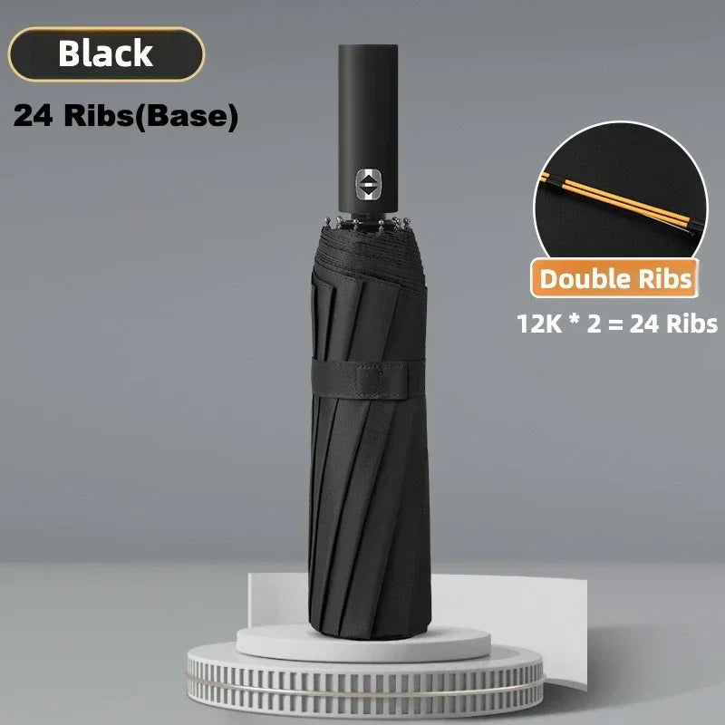 Black umbrella with 24 ribs base shown standing on a white circular stand.