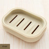 A beige compact travel soap holder with a secure lid, featuring three slots for holding bars of soap.