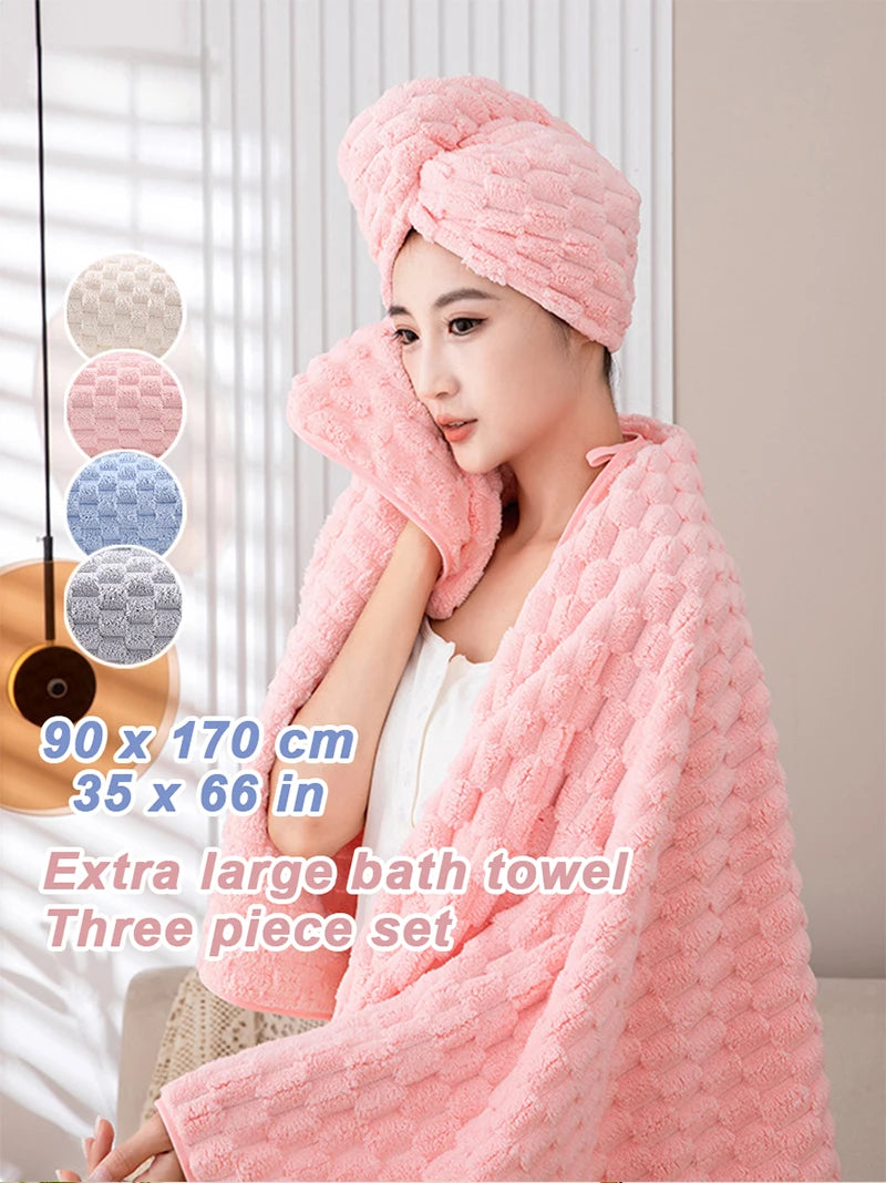 A woman is wrapped in a pink plush coral velvet bath towel three-piece set with white clothing.