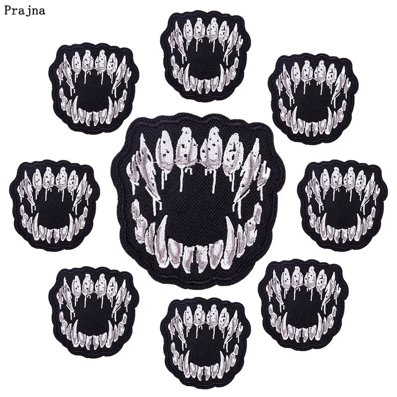 A set of ten black and white embroidered iron-on patches featuring skull and horror designs.