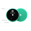 A circular green foam polishing pad with a black detailing center and a silicone sponge on the side.
