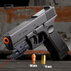 A gray toy pistol is shown with spent shell cartridges and brass bullets on a wooden surface.