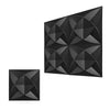 A close-up view of a black, diamond-textured wall panel design with overlapping geometric shapes.