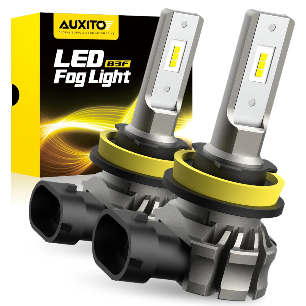 A pair of LED fog lights with silver housings and yellow accents are shown next to their packaging box.