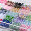 A clear box filled with various mixed acrylic beads in multiple colors and styles for jewelry making