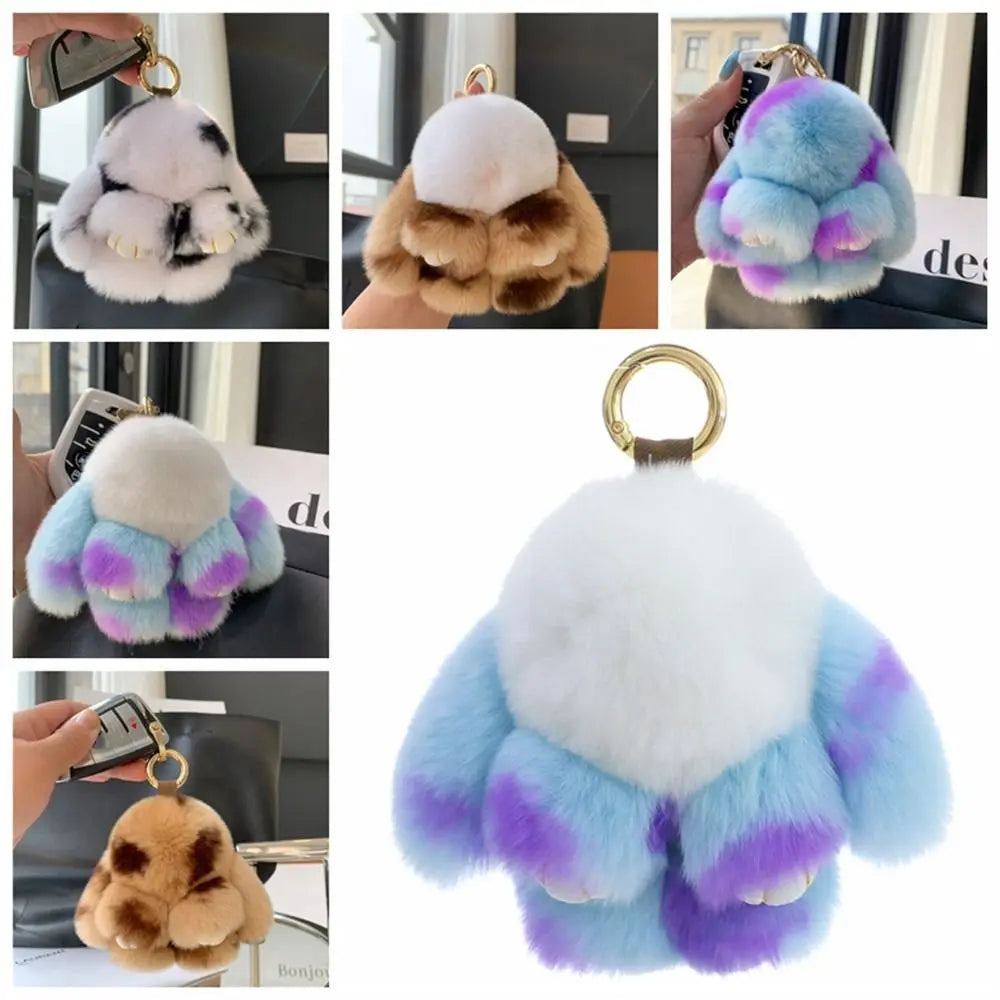 A soft plush bunny keychain featuring white and purple fur with an alloy ring.