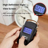 A hand holds a black portable digital luggage scale with an LCD display showing 0.000 kg.