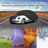 A black waterproof custom-fit car cover protects a white VW New Beetle from various weather elements.