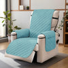 A teal quilted recliner sofa cover with side pockets displayed on a light-colored chair.
