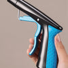 Close-up of an ergonomic handle and grip trigger for a foldable grabber tool with a magnetic swivel head.