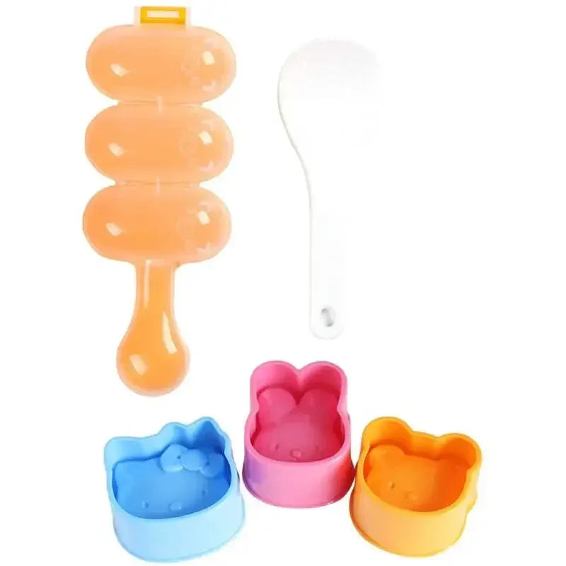 A set of silicone rice ball moulds and a paddle for making DIY bento food items in various colors.