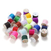 A collection of spools of 0.8mm nylon macramé cord in various colors including green, yellow, purple, and black.