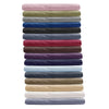A stack of twelve soft brushed microfiber pillowcases in various muted and deep colors.