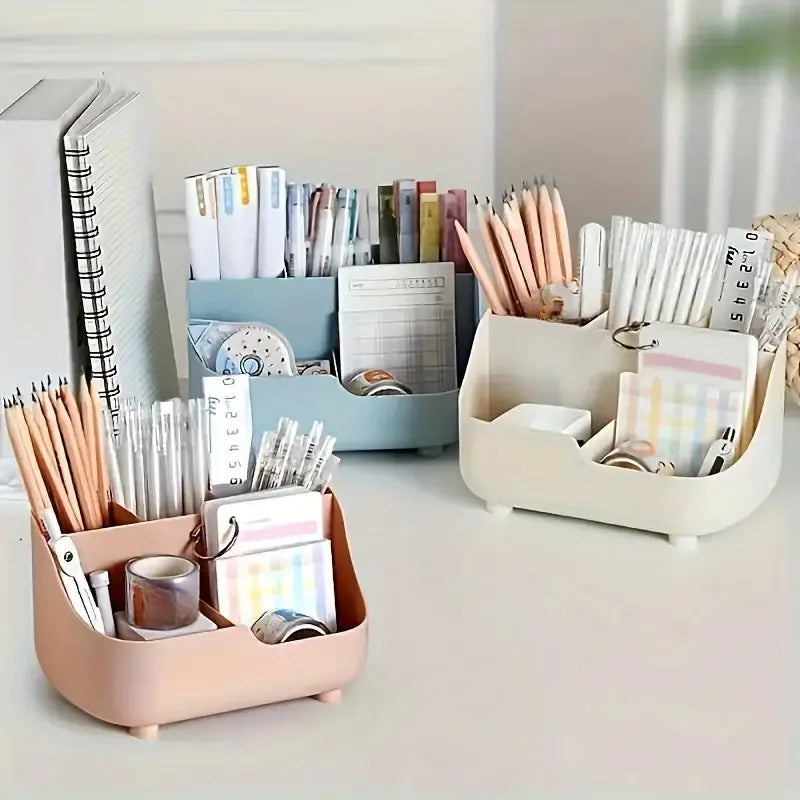 A light pink desktop organizer holding various office and school supplies like pens, pencils, and notebooks.