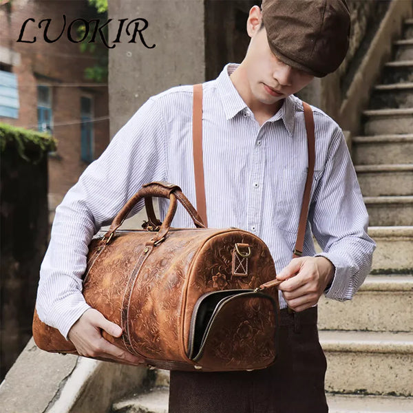 A young man holds a vintage embossed leather travel duffle bag in front of an outdoor staircase.