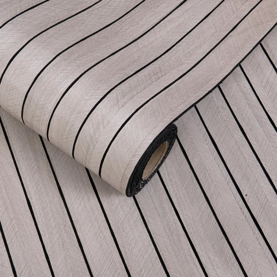 Roll of 3D grille pattern peel-and-stick wallpaper showing vertical black lines on a light gray background