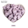 A pile of lilac silicone crown star heart beads for DIY jewelry making