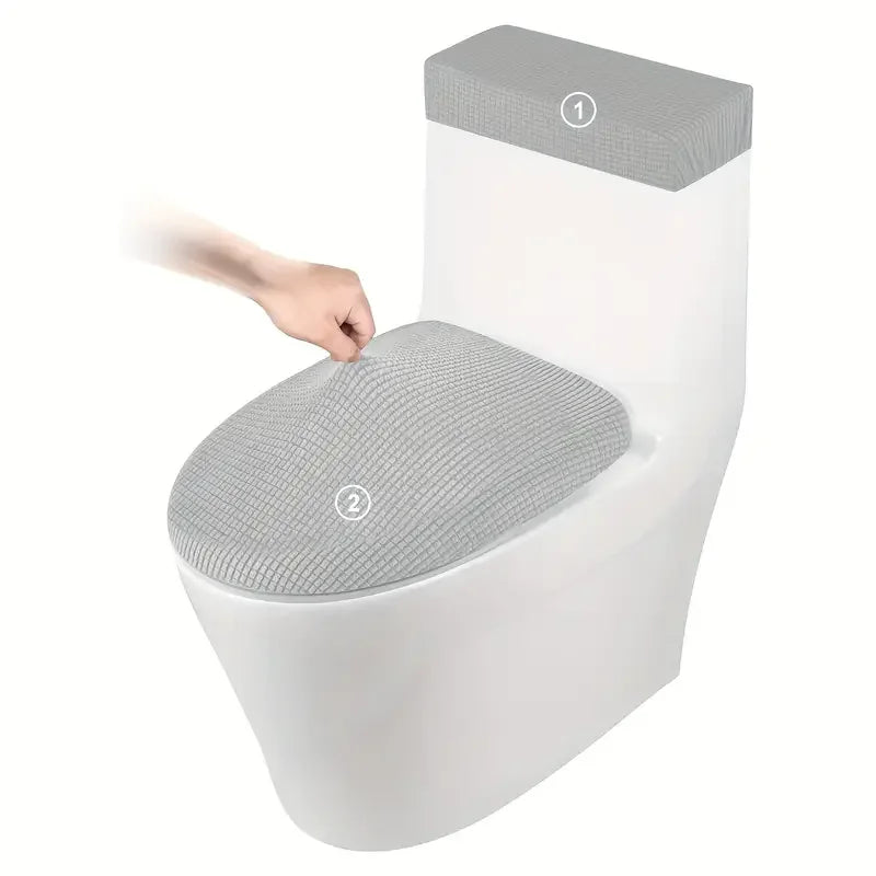 A white toilet seat with a gray fleece cover and lid, showing two numbered parts.