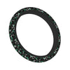 A black steering wheel cover with a dark green and black camouflage pattern.