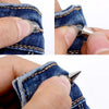 Close-up of hands installing zinc alloy cone studs and spikes onto denim fabric for DIY clothing
