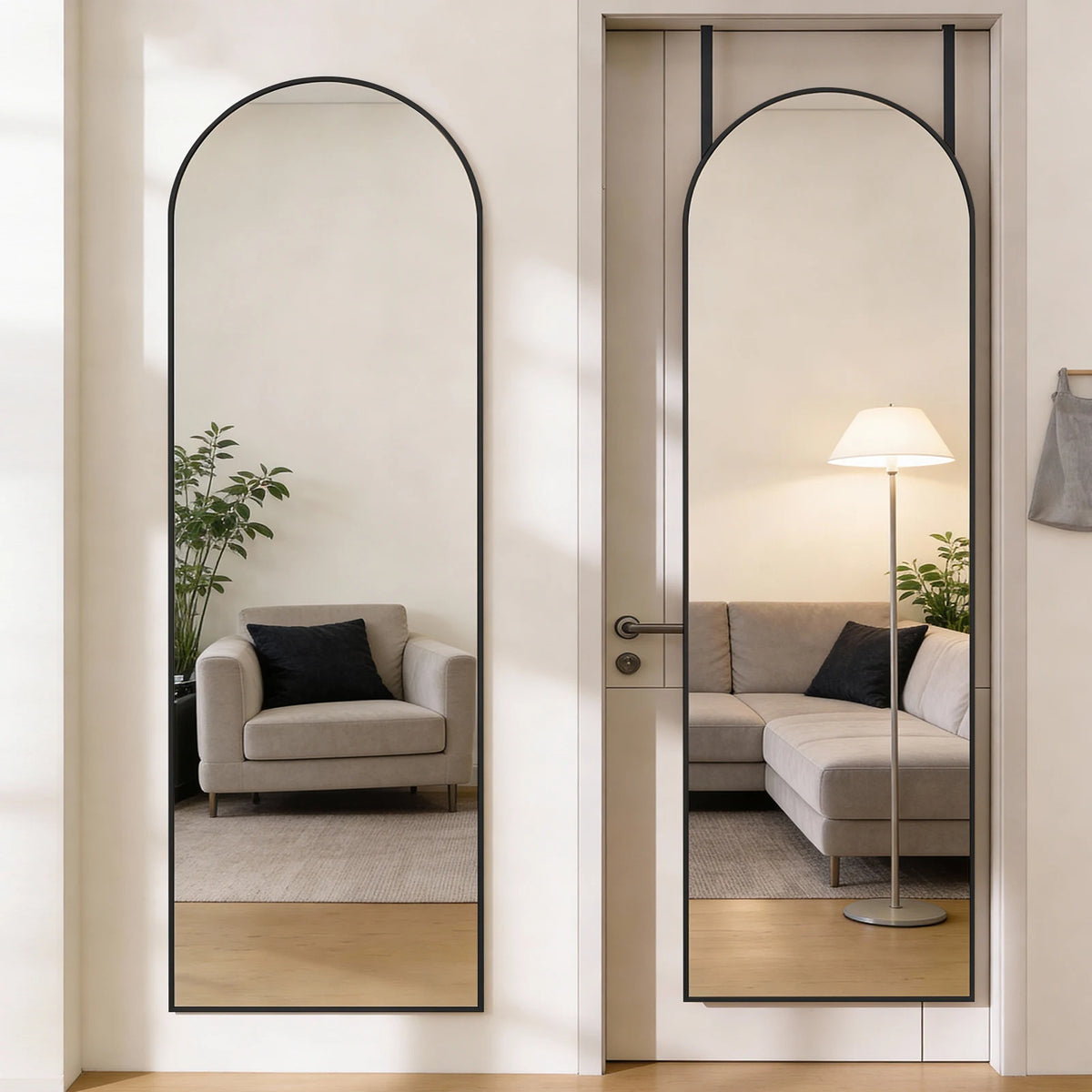A full length oval wall mirror with a black frame reflects a modern living room interior.