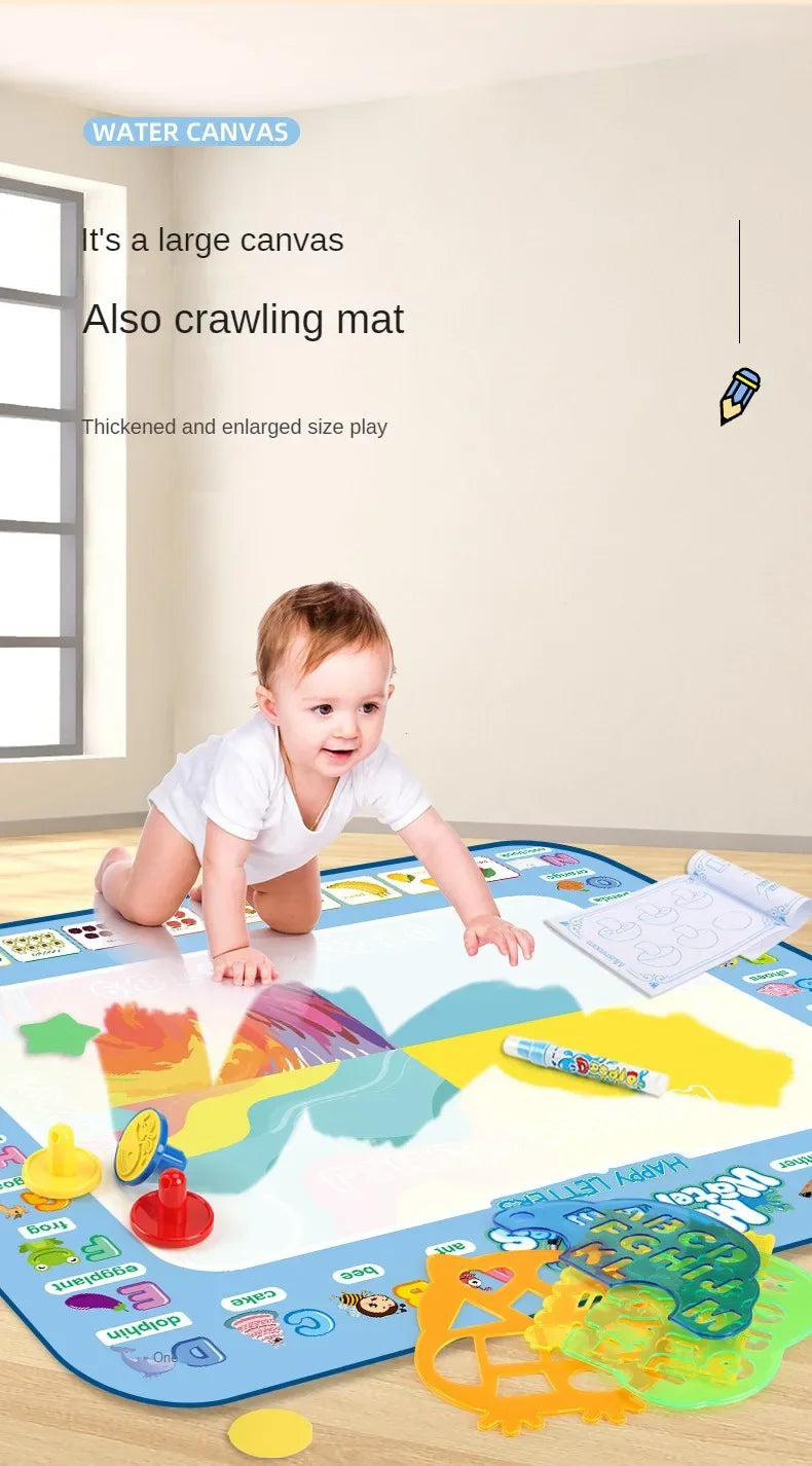 A large reusable water drawing mat with various colorful items and magic pens laid out on a wooden table.