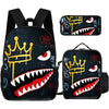 A set of three black backpacks featuring a graphic print of a crown and a shark's mouth.