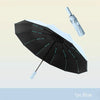 A black and white automatic windproof travel umbrella is shown open against a light background.