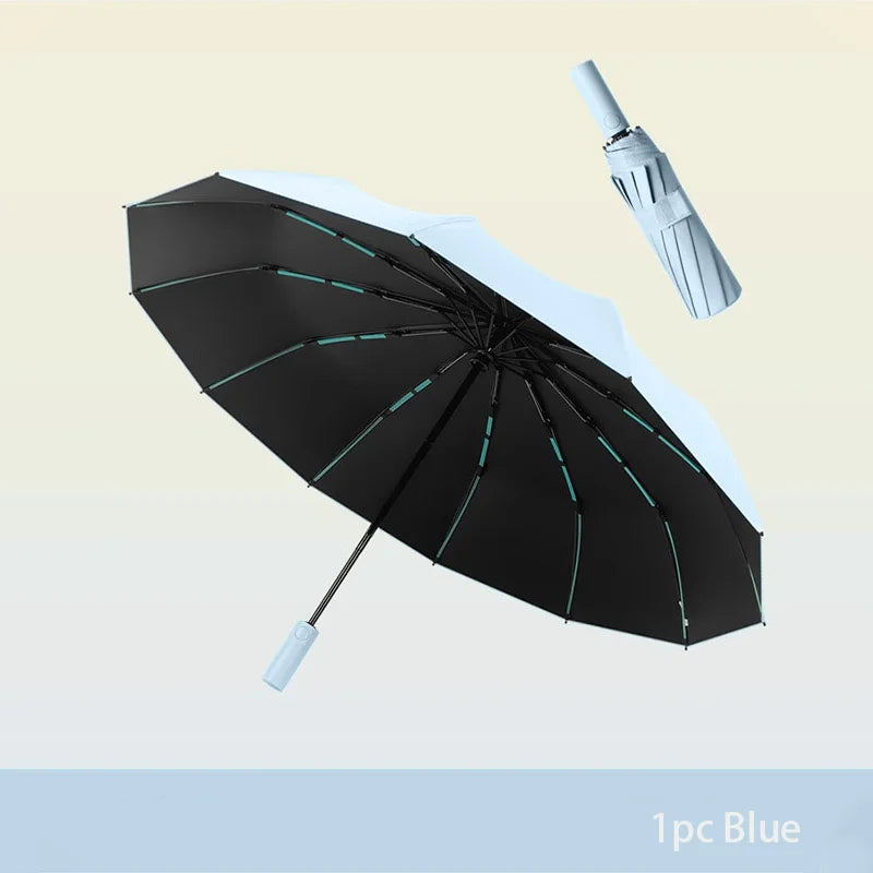 A black and white automatic windproof travel umbrella is shown open against a light background.