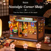 A wooden replica of a nostalgic Japanese corner shop display featuring various goods and an LED light.