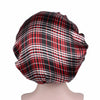 A black and red plaid satin hair bonnet displayed on a mannequin head.