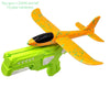 An orange toy gun with a propeller and a green foam glider plane launcher set for kids.